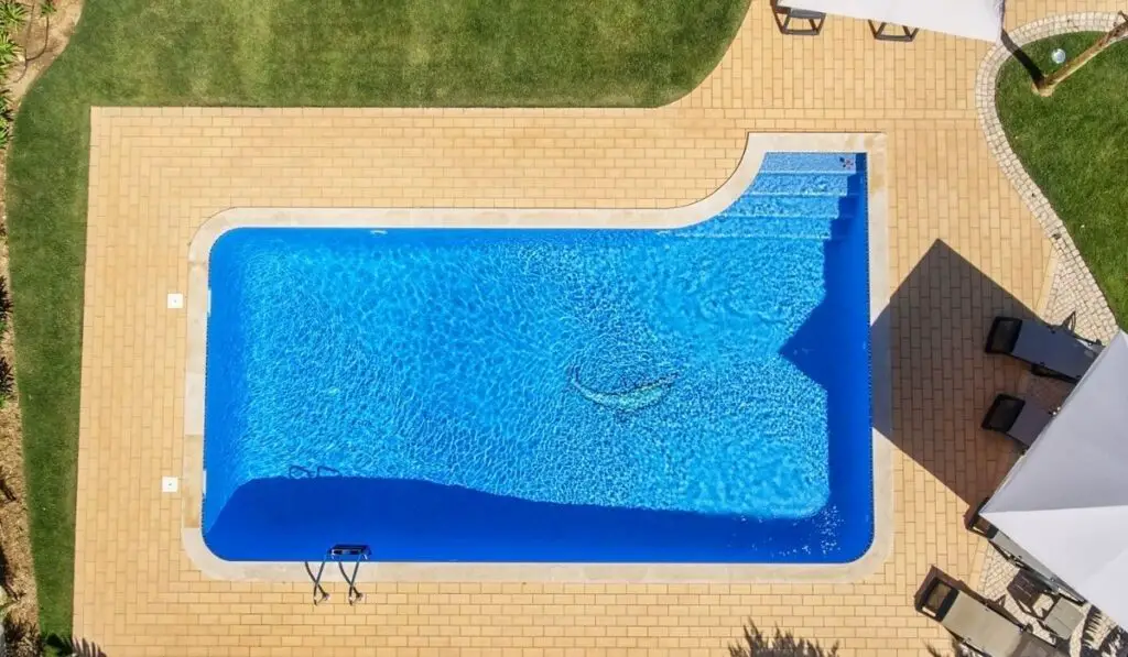 Aerial view of swimming pool outside hotel