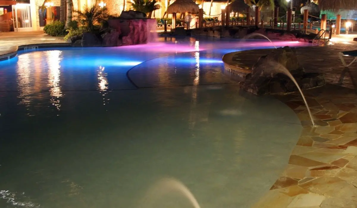 Lights reflected over a resort pool