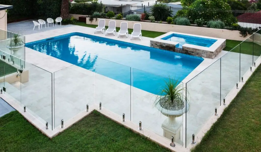 Modern swimming pool covered with glass panels