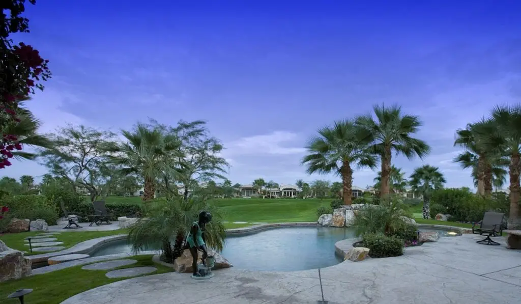 Swimming Pool In Backyard Of Home 