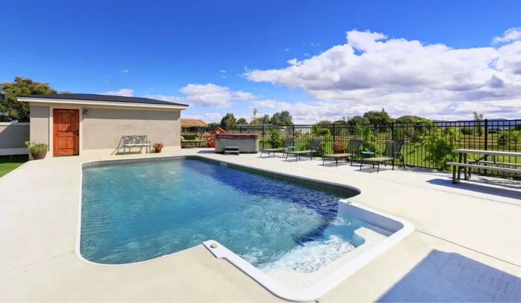 Swimming pool at the back yard of luxury house 