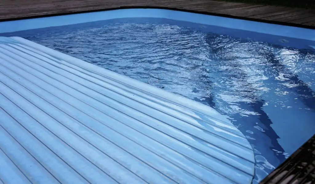 An Automatic swimming pool covering system 