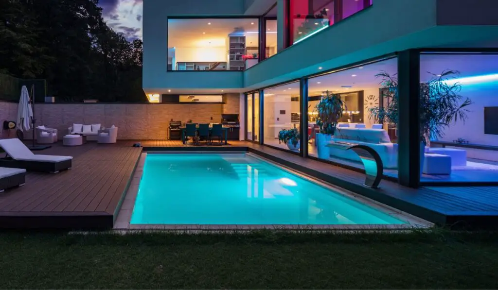 Modern villa with colored led lights at night 