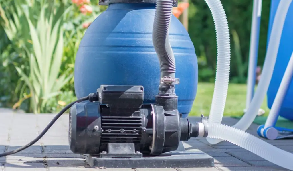 Sand filter plant at a pool in the garden