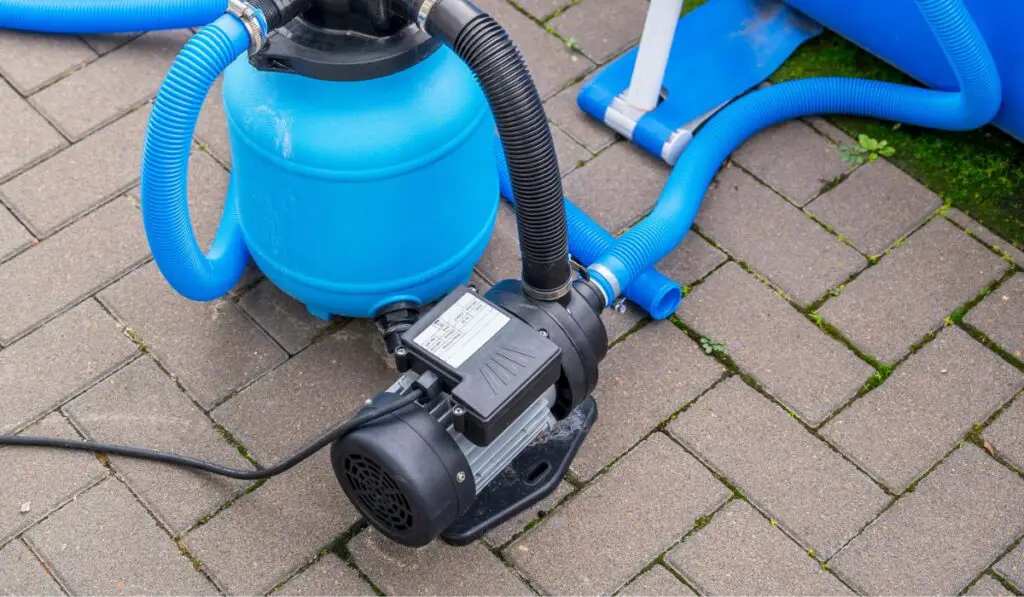 Sand filter system of a pool with algae water after insufficient water maintenance