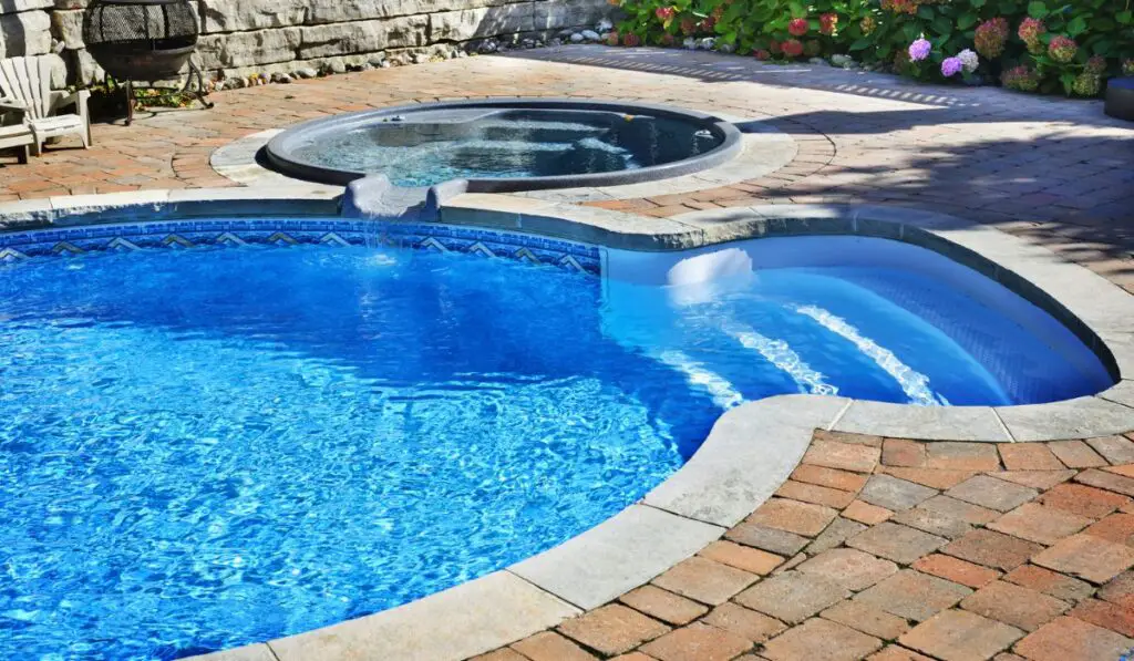 Swimming pool with hot tub