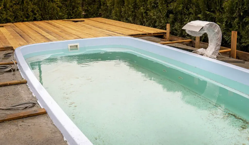 Unfinished pool with wooden floor