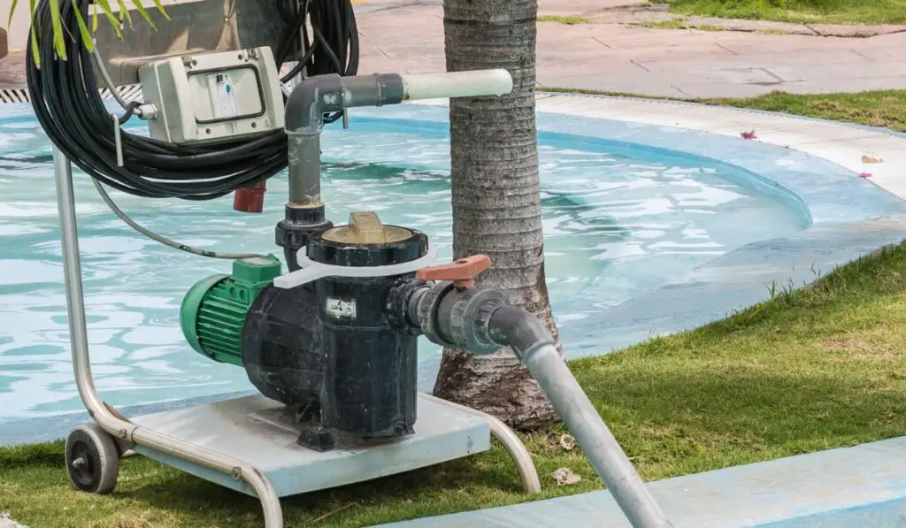 Fragment of view of old technology electrical pump for cleaning swimming pool