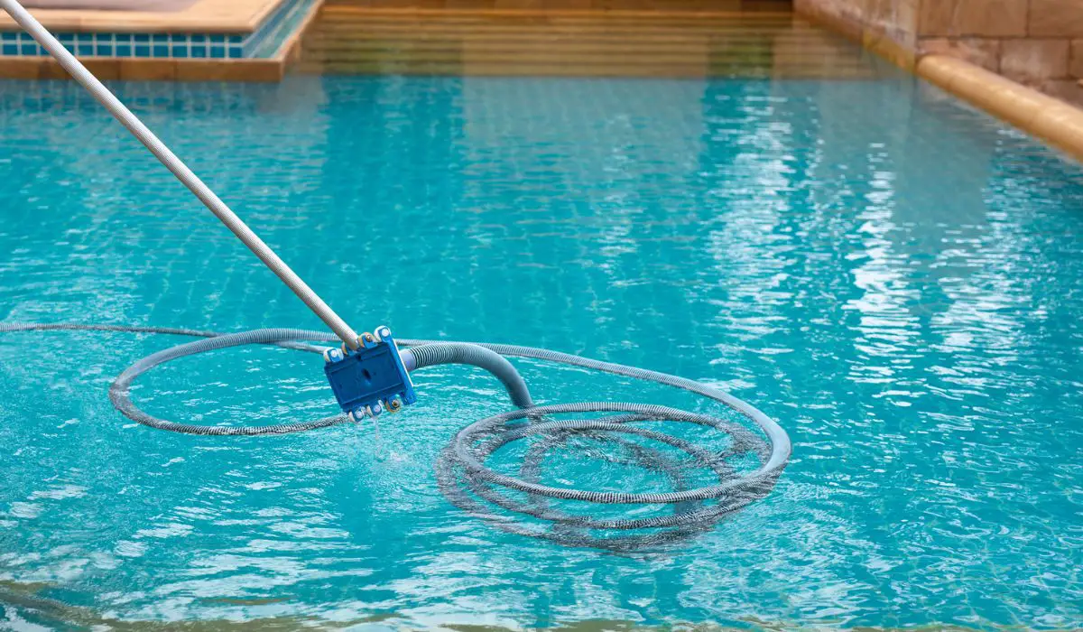 Pool vacuum cleaning dirty in bottom of swimming pool