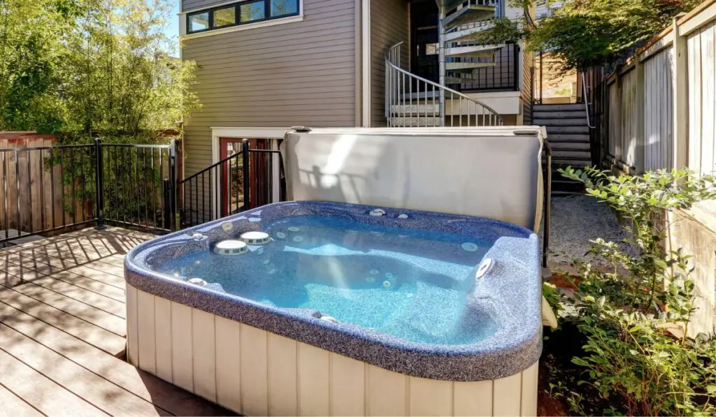 Small Wooden walkout deck with hot tub