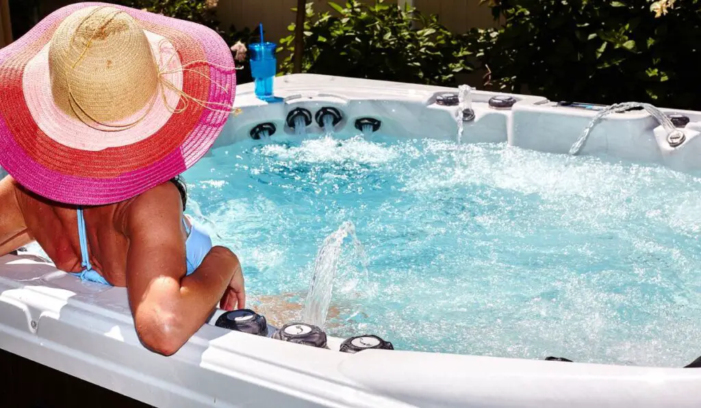 Beautiful woman relaxing in hot tub 