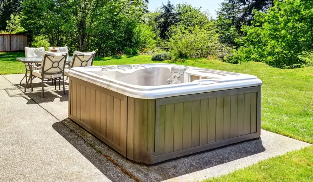 Patio area with hot tub