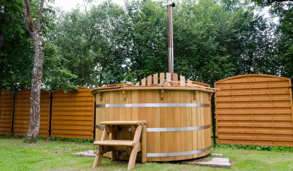 Rural wooden water hot tub with stairs garden yard