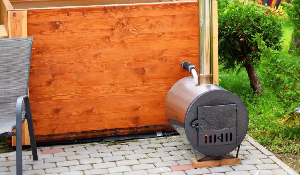 Wooden hot tub with smoky chimney