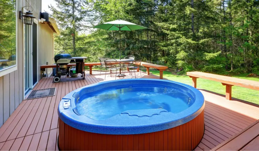 House backyard with hot tub