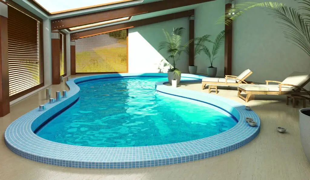 Indoor spa pool with chairs and plants