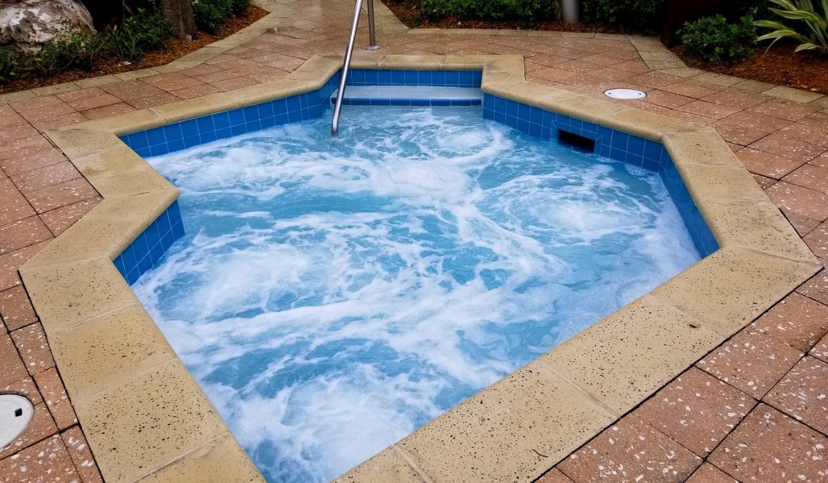 The top view of blue hot tub with rushing water