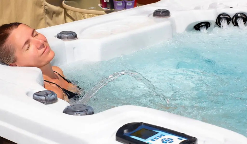 Beautiful woman relaxing in hot tub