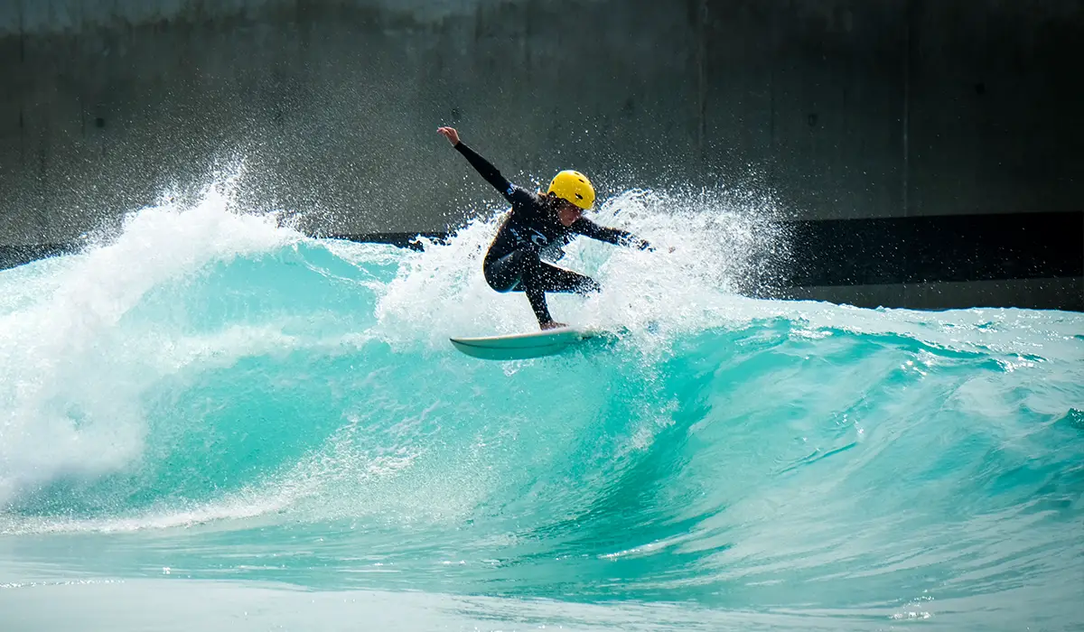 Man surfing in wave pool